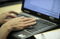 Photo: delegate using laptop